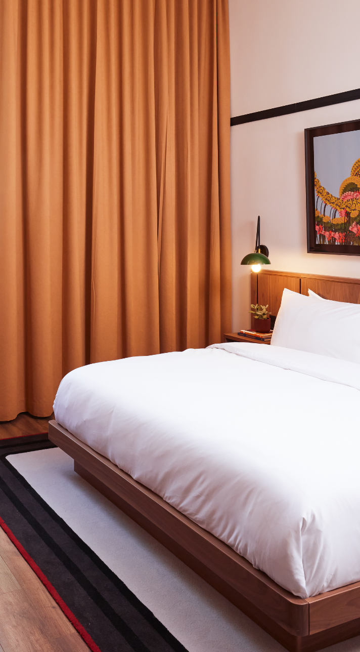 postmark hotel deluxe king suite bed