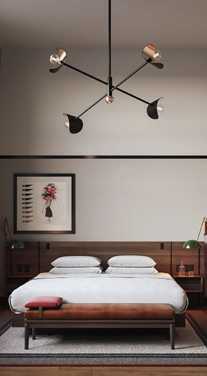 Postmark Hotel guest suite with king sized bed on modern wooden bedframe