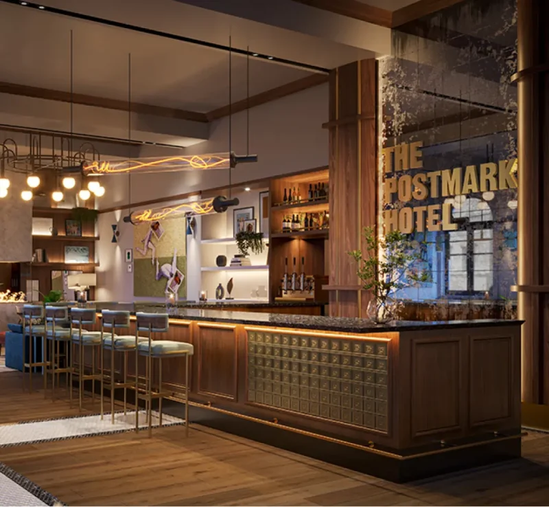 Ambient lit Postmark Hotel lobby and bar with check in desk and bar seating