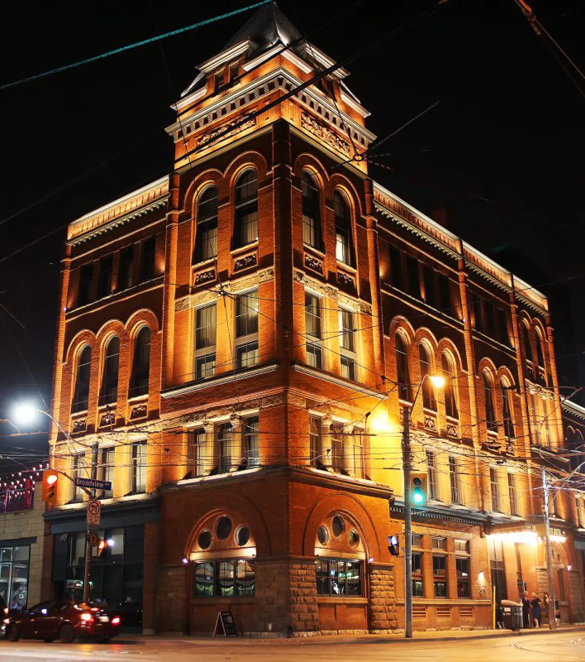 The Broadview Hotel building exterior at night with bright lighting to display the building prominently