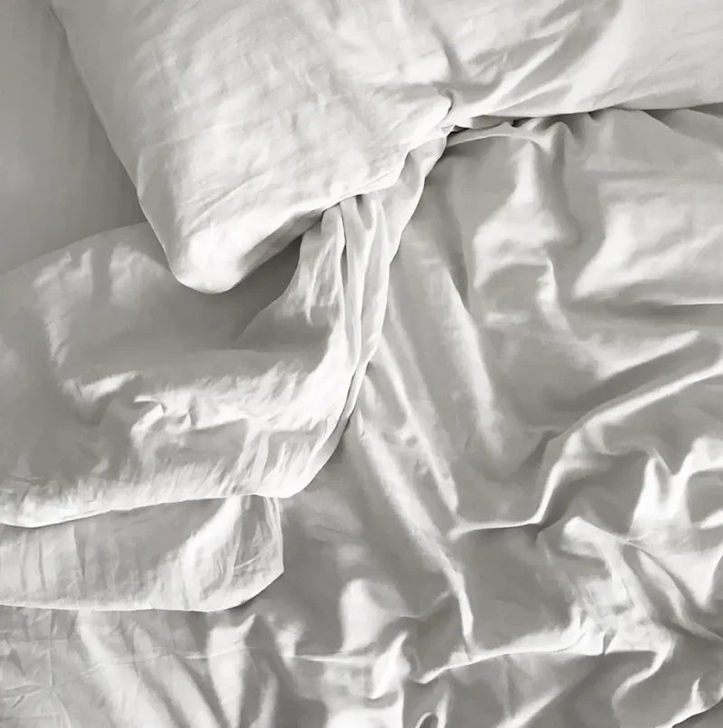 Top down photo of hotel duvet and bed sheets